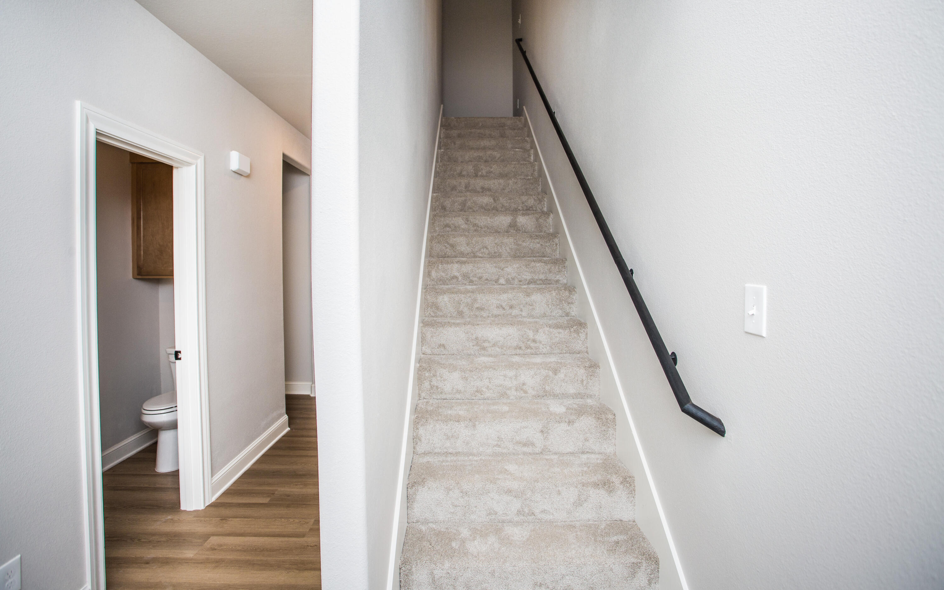 2544 137th Street Lubbock, TX 79423 - Photo 31 of 43 a view of a hallway with wooden floor and staircase