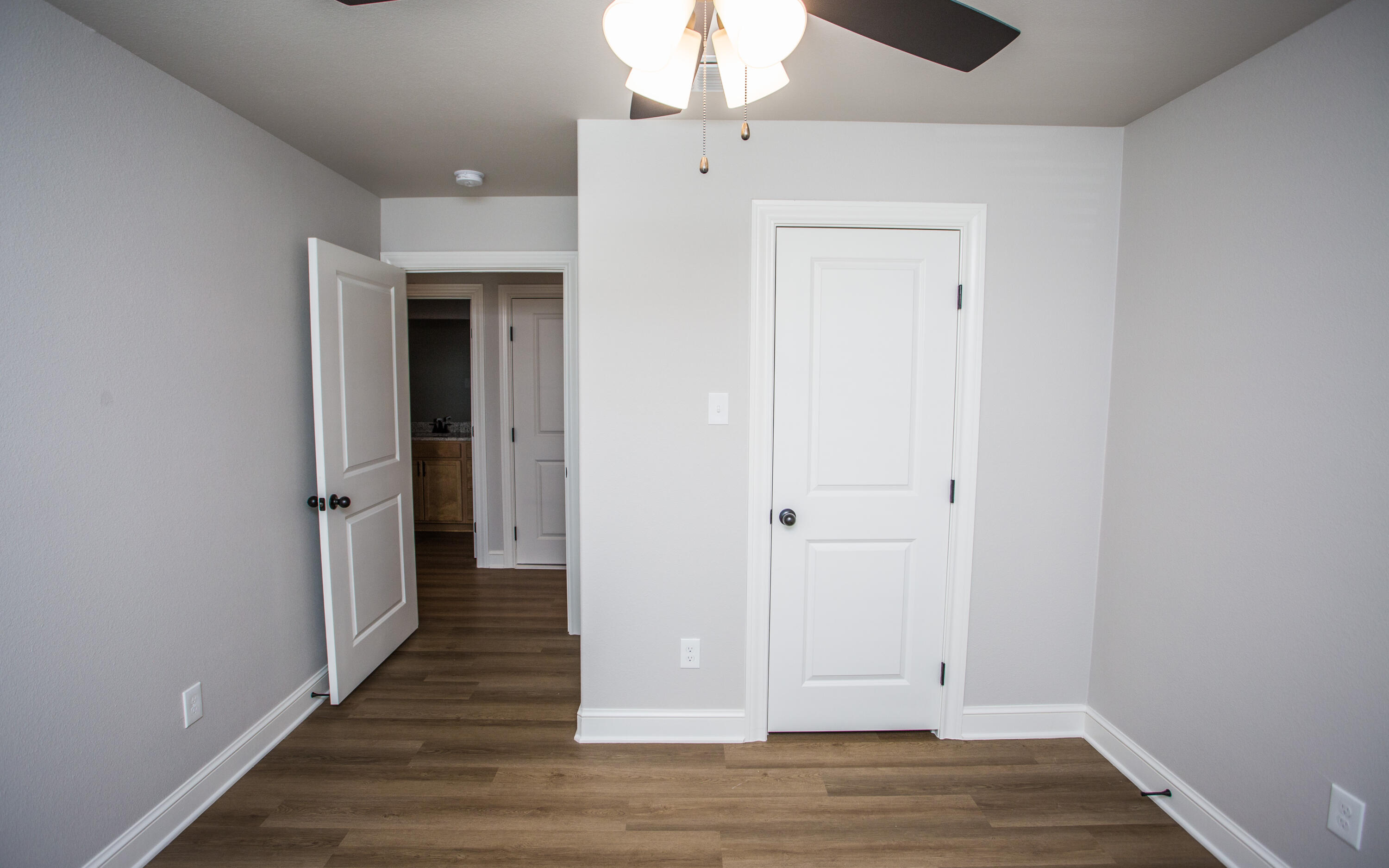 2544 137th Street Lubbock, TX 79423 - Photo 33 of 43 a view of a hallway with wooden floor