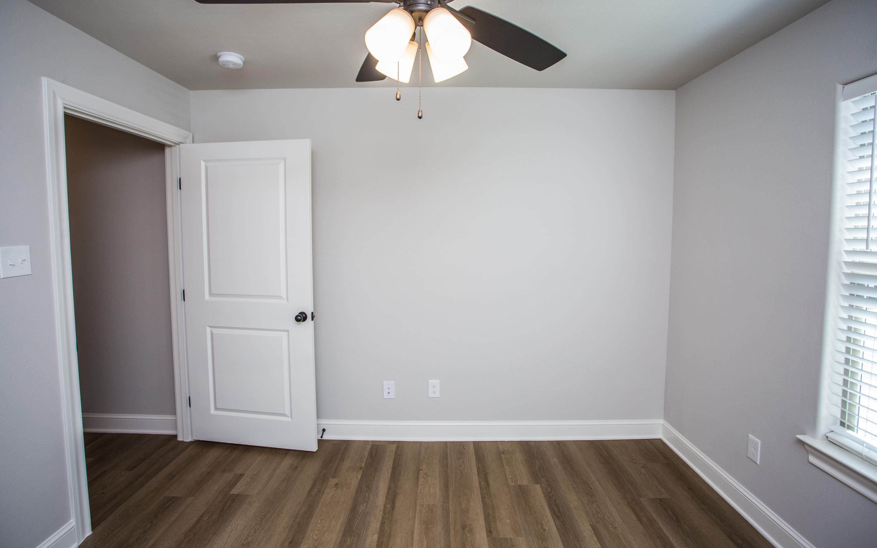 2544 137th Street Lubbock, TX 79423 - Photo 35 of 43 wooden floor in an empty room with a window