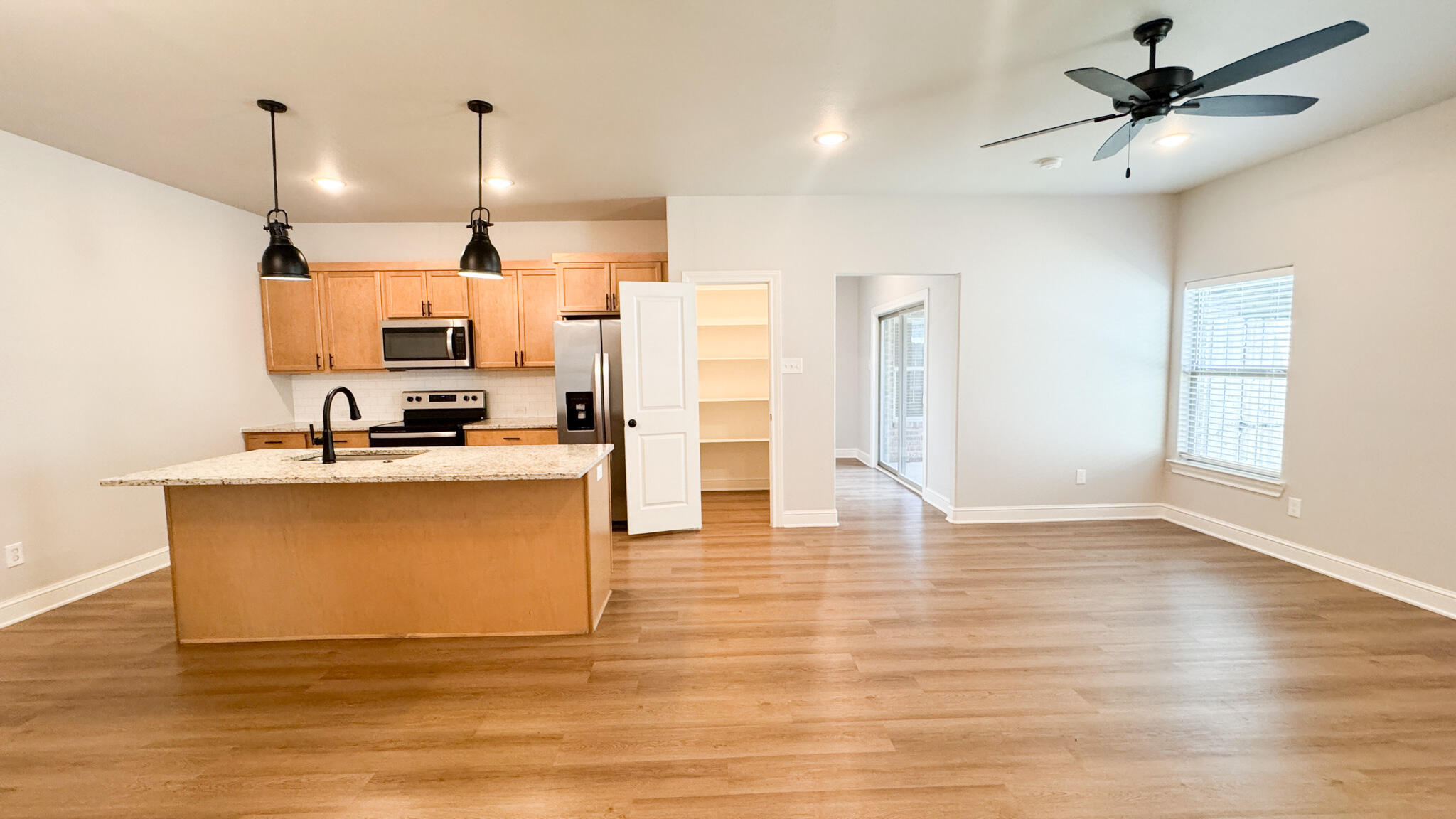 2544 137th Street Lubbock, TX 79423 - Photo 7 of 43 a view of kitchen with microwave and refrigerator