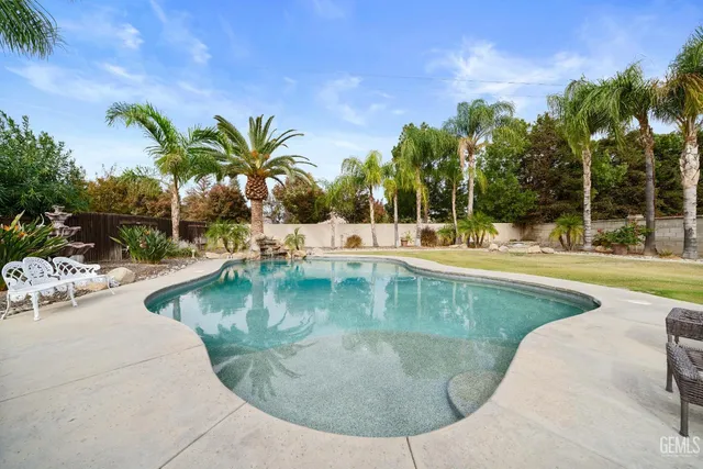 a view of a swimming pool with a patio