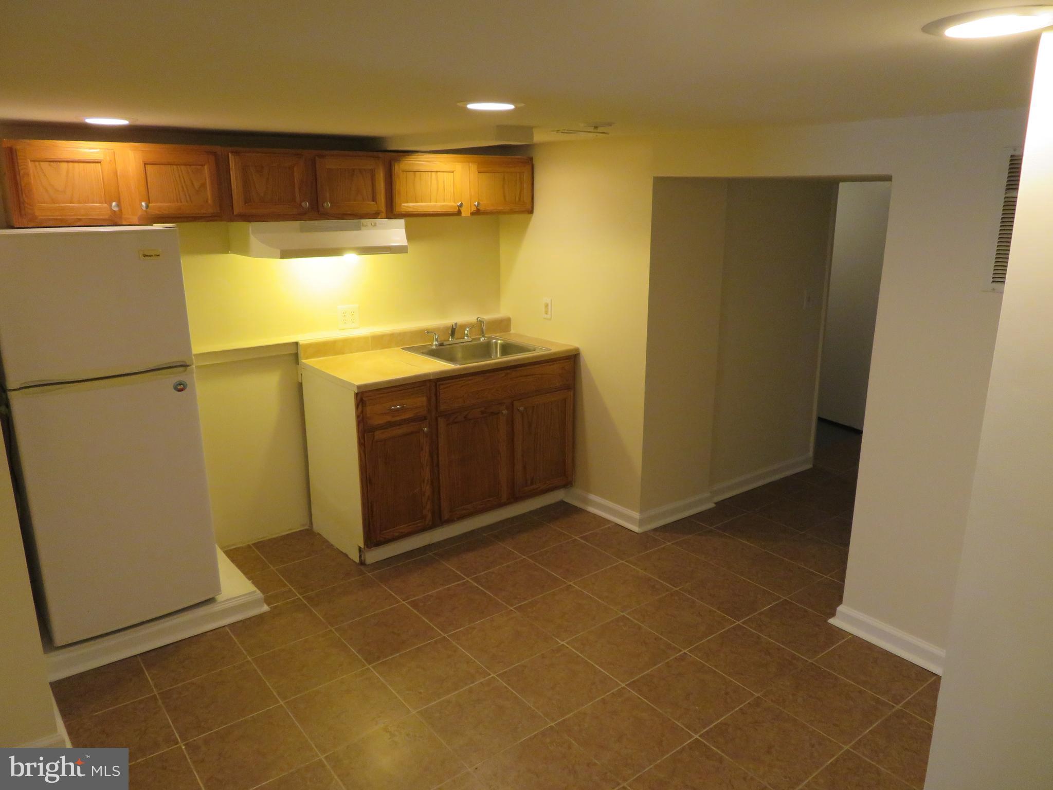 5414 Quesada Road Riverdale, MD 20737 - Photo 23 of 33 Basement Kitchenette and Hallway to Utilities