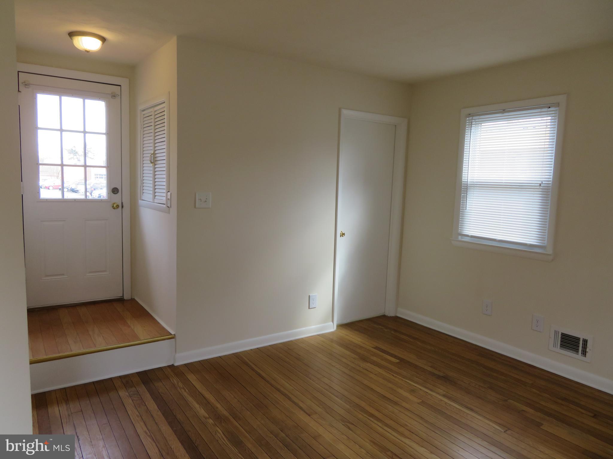 5414 Quesada Road Riverdale, MD 20737 - Photo 7 of 33 Living Area, Rear Door and Basement Door