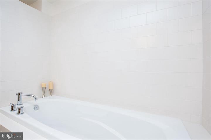 1200 Steuart Street, Unit 428 Baltimore, MD 21230 - Photo 35 of 53 a bathroom with a bathtub