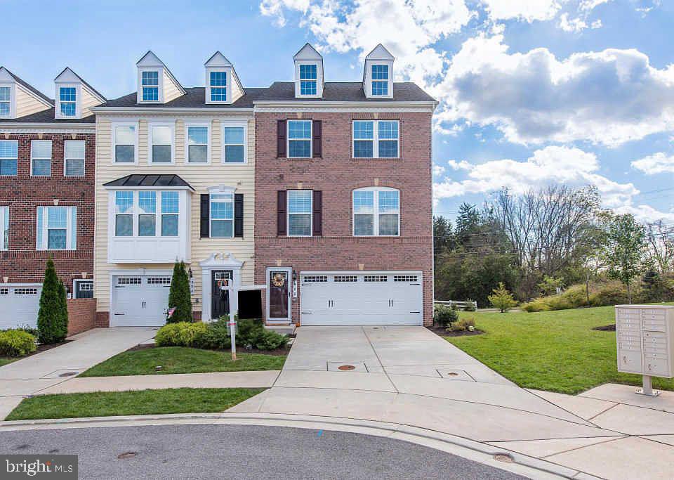 1200 Steuart Street, Unit 428 Baltimore, MD 21230 - Photo 53 of 53 a front view of a house with a yard