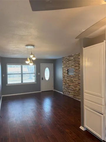 a stove top oven sitting inside of a kitchen