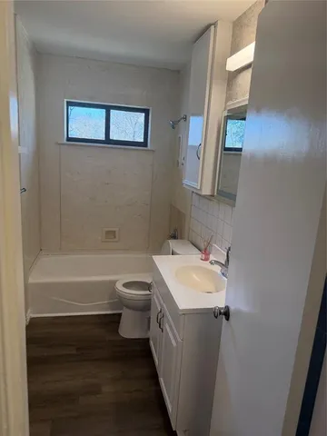 a view of a yard with a large tree