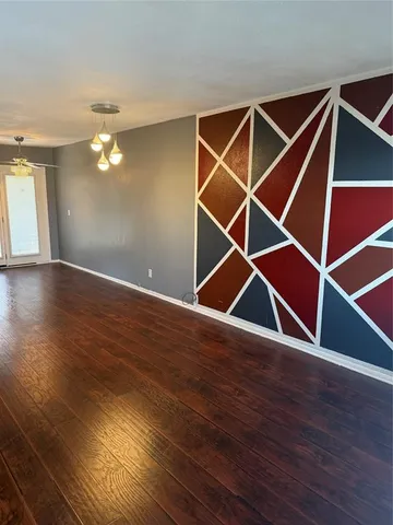 an empty room with a empty space and a window