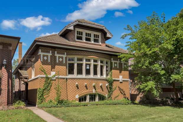 6727 Riverside Drive Berwyn, IL 60402 - Photo 1 of 30 a front view of a house with a yard