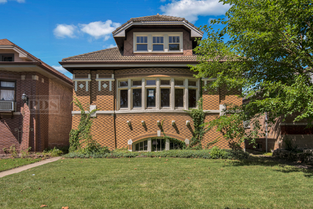 6727 Riverside Drive Berwyn, IL 60402 - Photo 2 of 30 a front view of a house with a yard