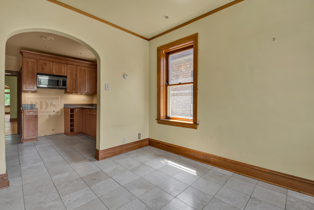 6727 Riverside Drive Berwyn, IL 60402 - Photo 13 of 30 an empty room with windows and cabinet