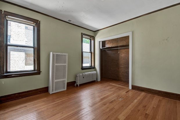6727 Riverside Drive Berwyn, IL 60402 - Photo 14 of 30 an empty room with wooden floor and windows