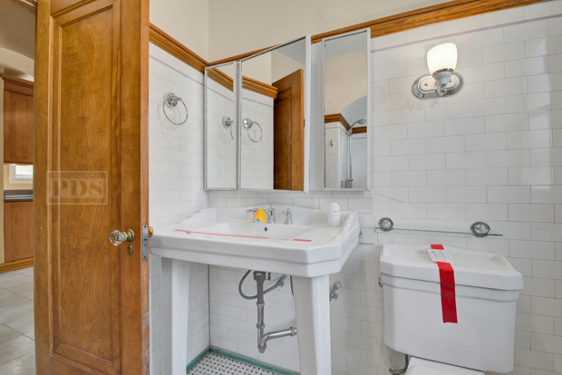 6727 Riverside Drive Berwyn, IL 60402 - Photo 19 of 30 a bathroom with a sink and a mirror