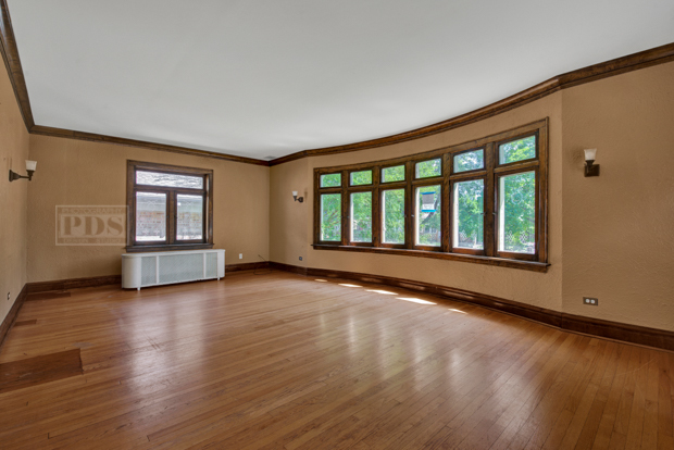 6727 Riverside Drive Berwyn, IL 60402 - Photo 3 of 30 a view of an empty room with wooden floor and a window