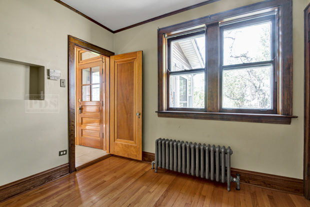 6727 Riverside Drive Berwyn, IL 60402 - Photo 21 of 30 an empty room with wooden floor and windows