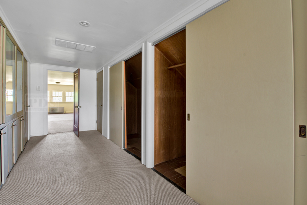 6727 Riverside Drive Berwyn, IL 60402 - Photo 22 of 30 a view of a hallway with wooden shelves