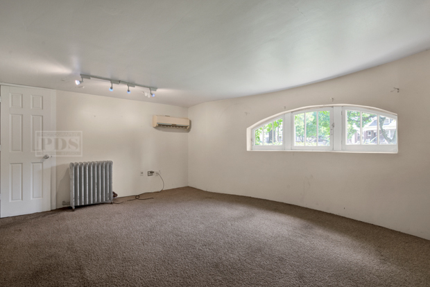 6727 Riverside Drive Berwyn, IL 60402 - Photo 28 of 30 an empty room with a empty space and windows