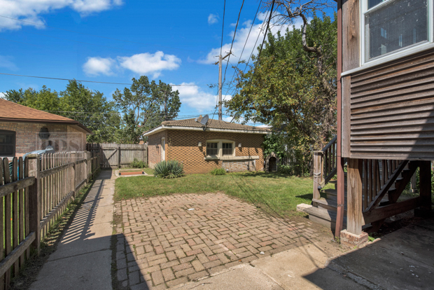 6727 Riverside Drive Berwyn, IL 60402 - Photo 29 of 30 a front view of a house with a yard and trees