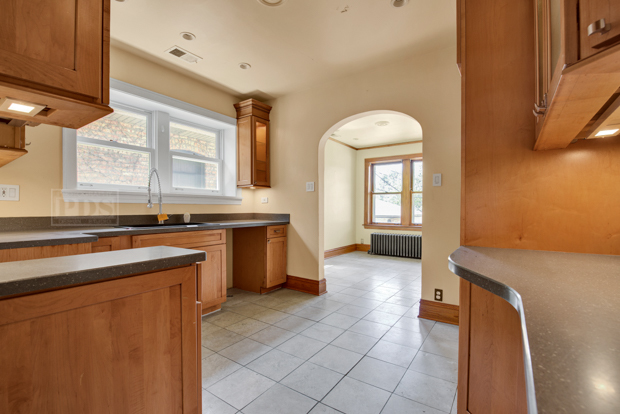 6727 Riverside Drive Berwyn, IL 60402 - Photo 8 of 30 a kitchen with a sink stove and cabinets