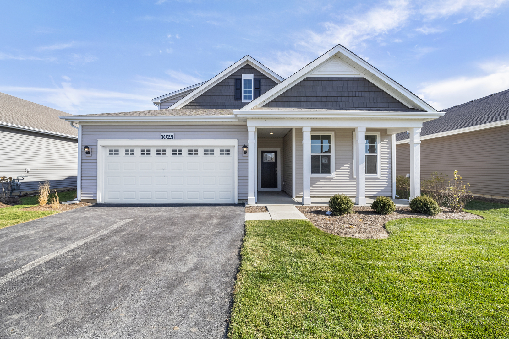 a view of a house with backyard and porch