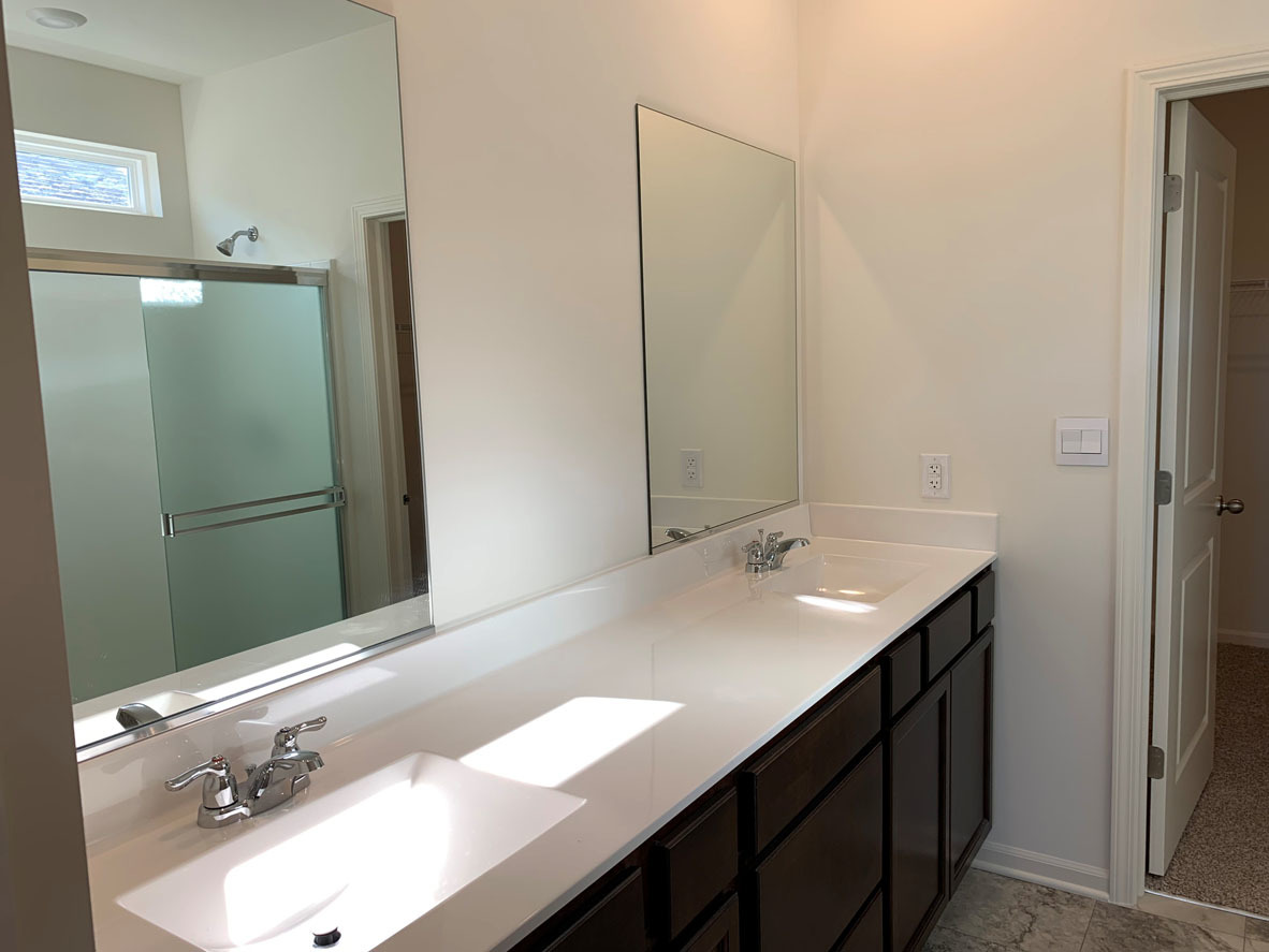 935 Eineke Boulevard Algonquin, IL 60102 - Photo 19 of 39 a bathroom with a double vanity sink and mirror