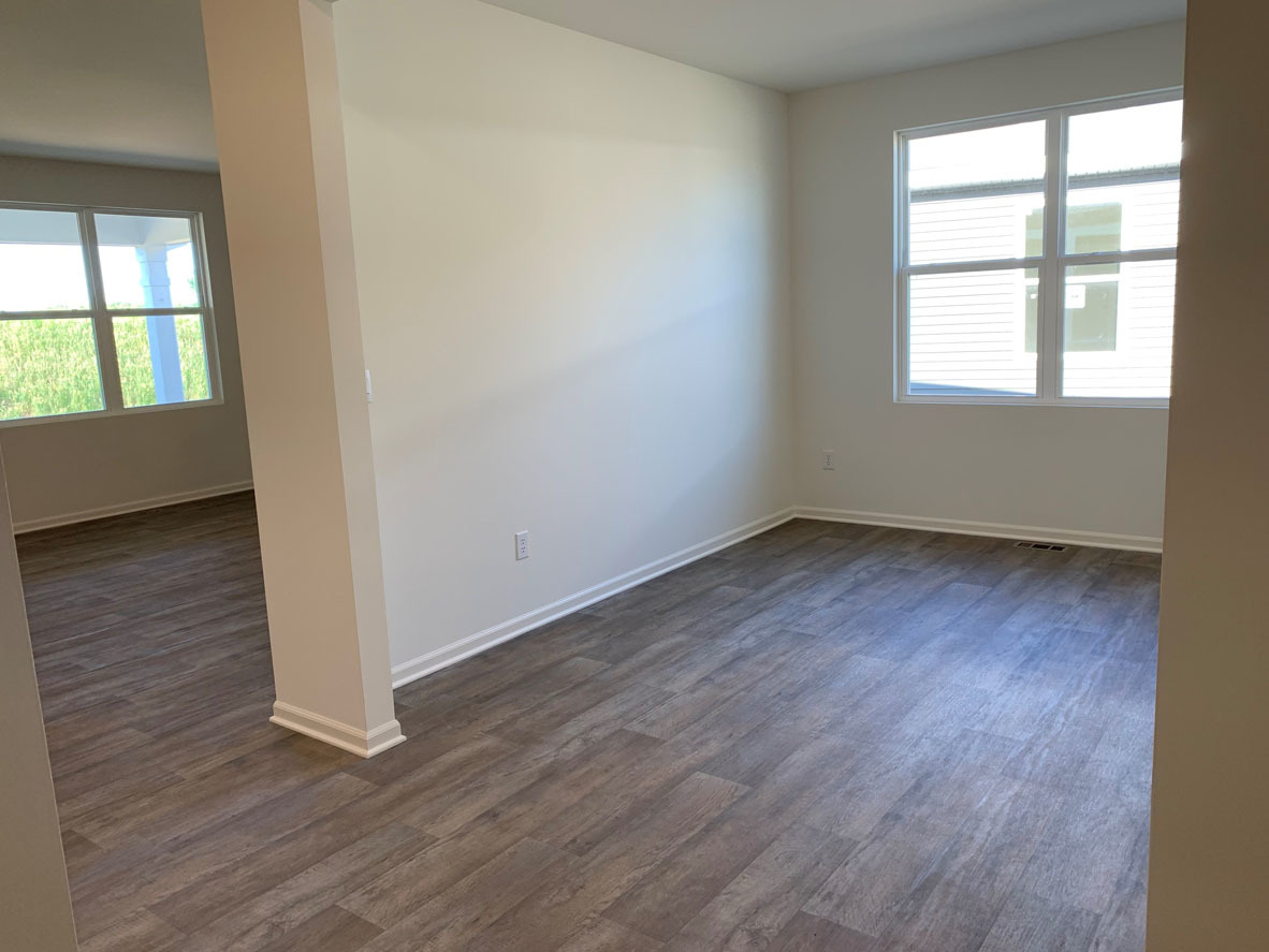 935 Eineke Boulevard Algonquin, IL 60102 - Photo 2 of 39 an empty room with wooden floor and windows