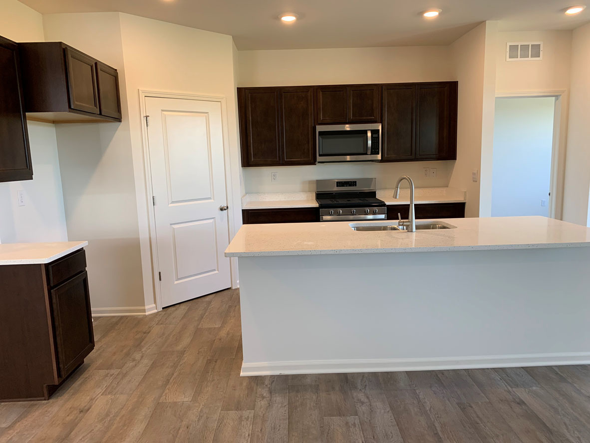 935 Eineke Boulevard Algonquin, IL 60102 - Photo 4 of 39 a kitchen with stainless steel appliances a refrigerator a stove top oven a sink and dishwasher