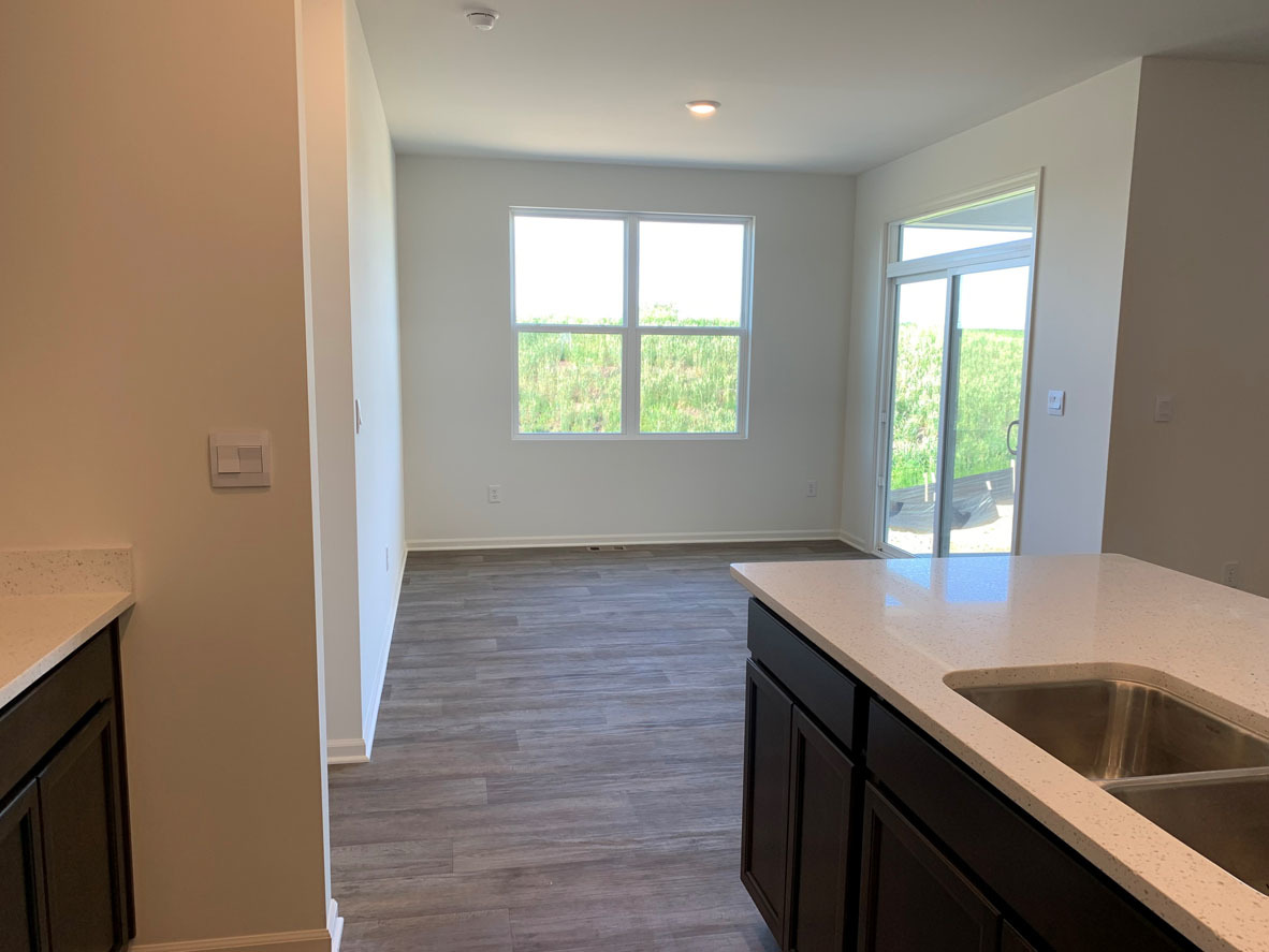 935 Eineke Boulevard Algonquin, IL 60102 - Photo 6 of 39 a kitchen with a sink cabinets and a large window