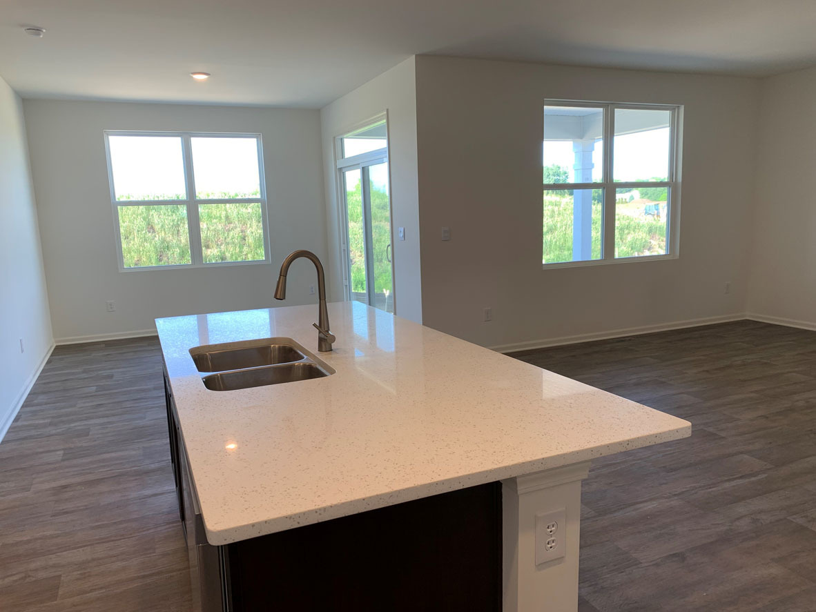 935 Eineke Boulevard Algonquin, IL 60102 - Photo 8 of 39 a kitchen with a wooden floor and a window