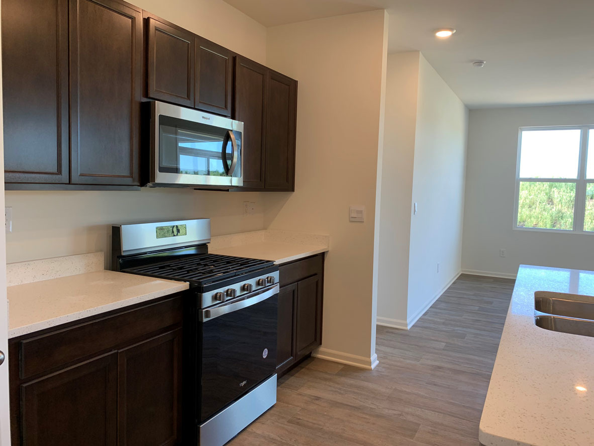 935 Eineke Boulevard Algonquin, IL 60102 - Photo 10 of 39 a kitchen with a stove and a microwave