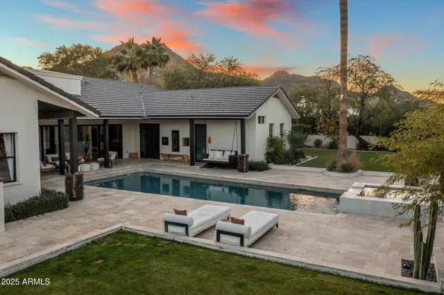 a view of house and outdoor space with swimming pool
