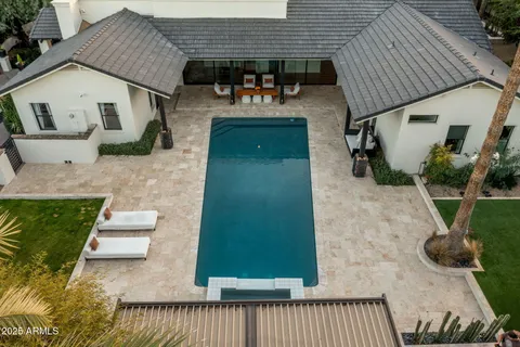 a view of a patio with table and chairs with wooden floor and plants