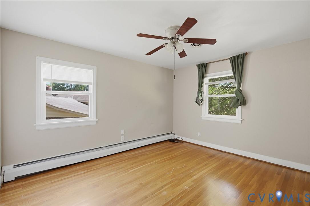 8210 Ireton Road Henrico, VA 23228 - Photo 14 of 36 wooden floor in an empty room with a window