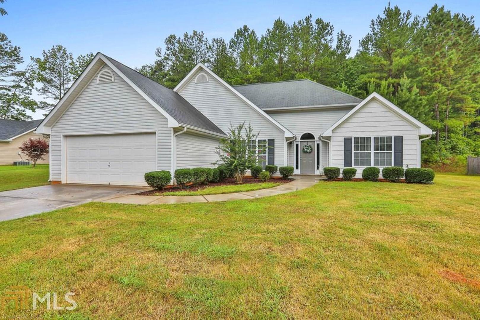135 Jenny Road Grantville, GA 30220 - Photo 1 of 1 a view of a house with a yard patio and swimming pool