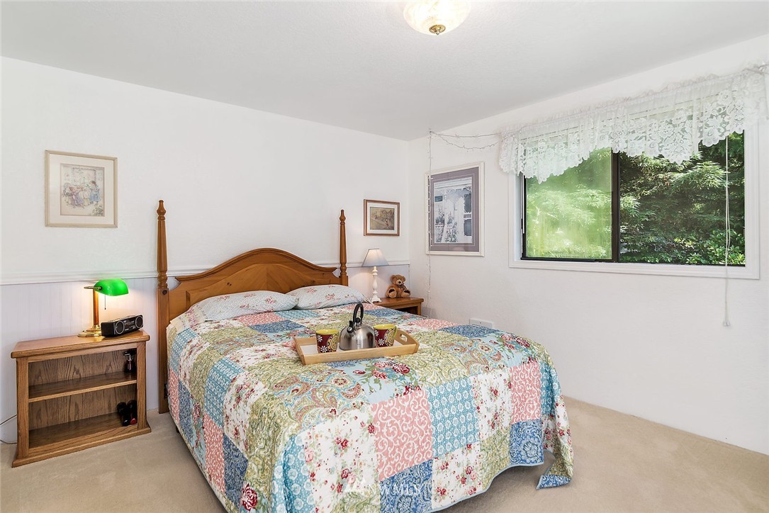 24517 Florence Acres Road Monroe, WA 98272 - Photo 5 of 14 a bedroom with a bed and a window