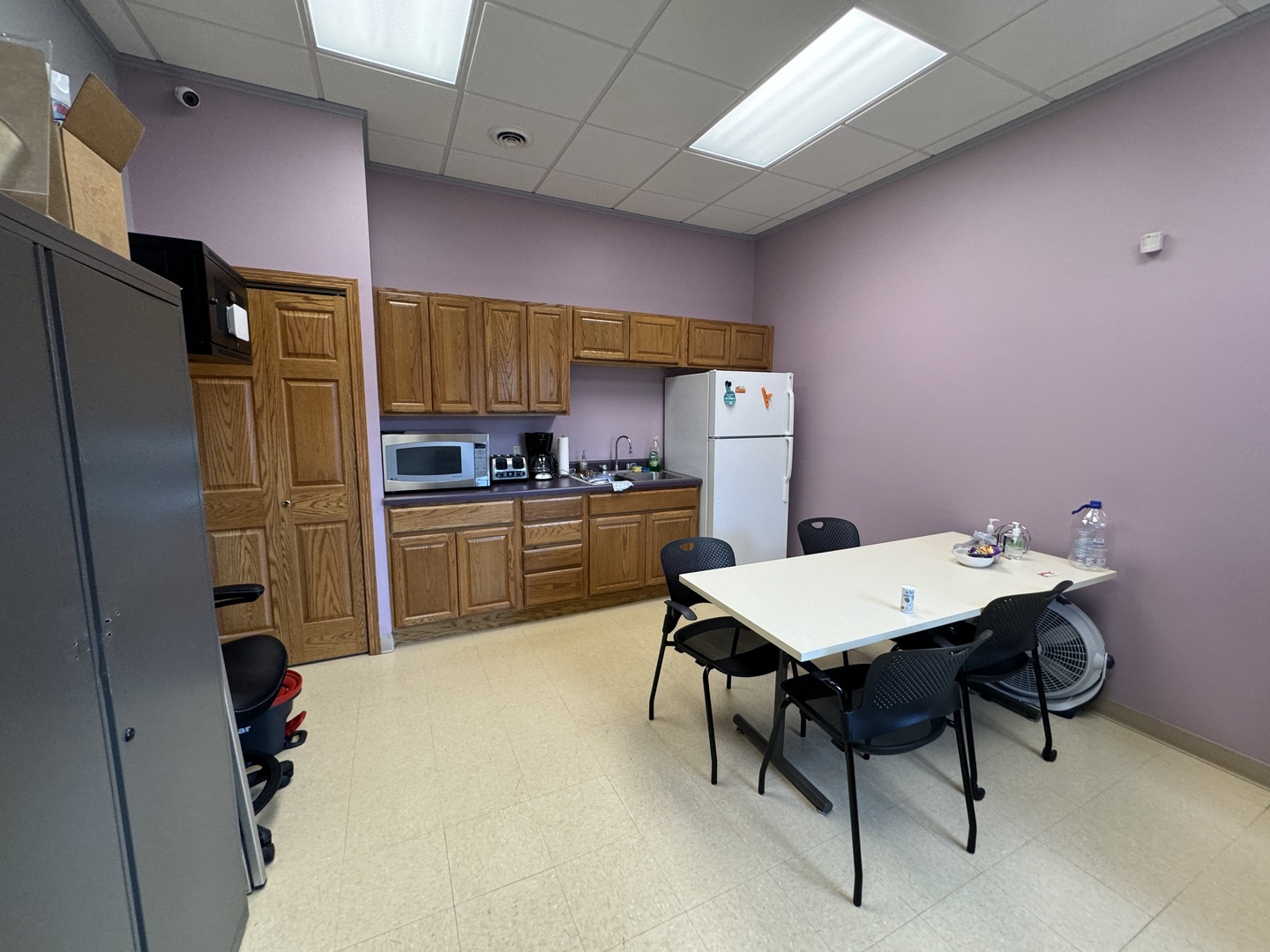 200 Ace Road, Unit 3 Princeton, IL 61356 - Photo 7 of 14 a kitchen with a table chairs refrigerator and a sink