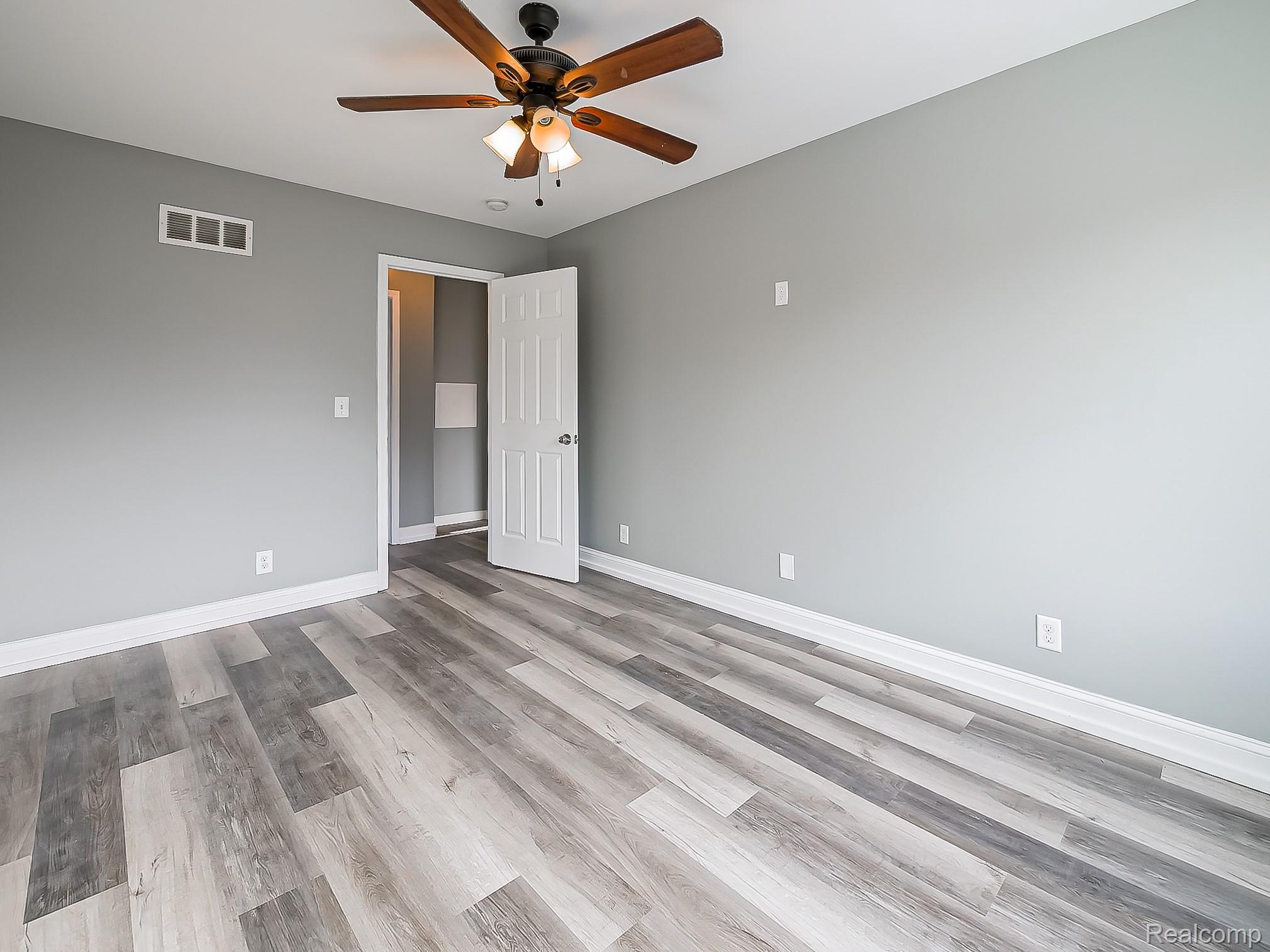 13 Mohawk Road Pontiac, MI 48341 - Photo 16 of 24 Unfurnished bedroom featuring light wood finished floors and ceiling fan