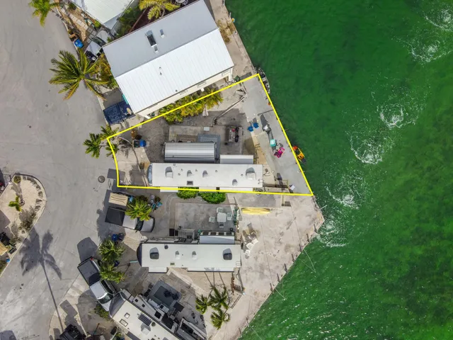 an aerial view of multiple house with outdoor space