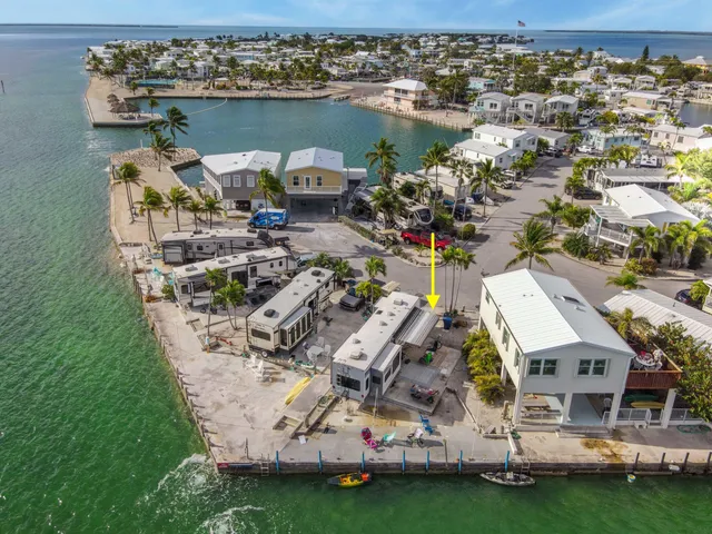 an aerial view of a houses with outdoor space