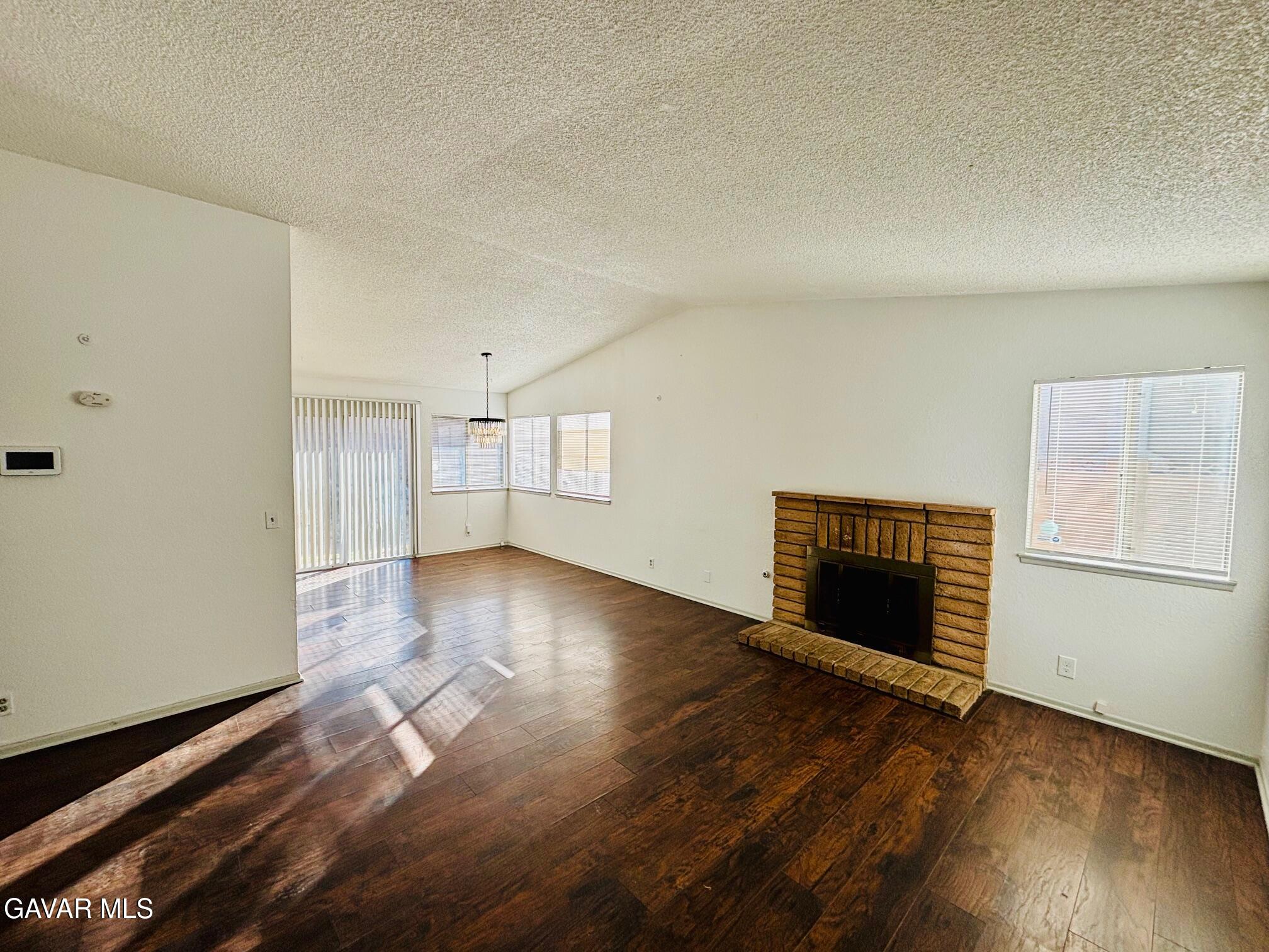 2308 Edam Street Lancaster, CA 93536 - Photo 2 of 16 a view of empty room with wooden floor