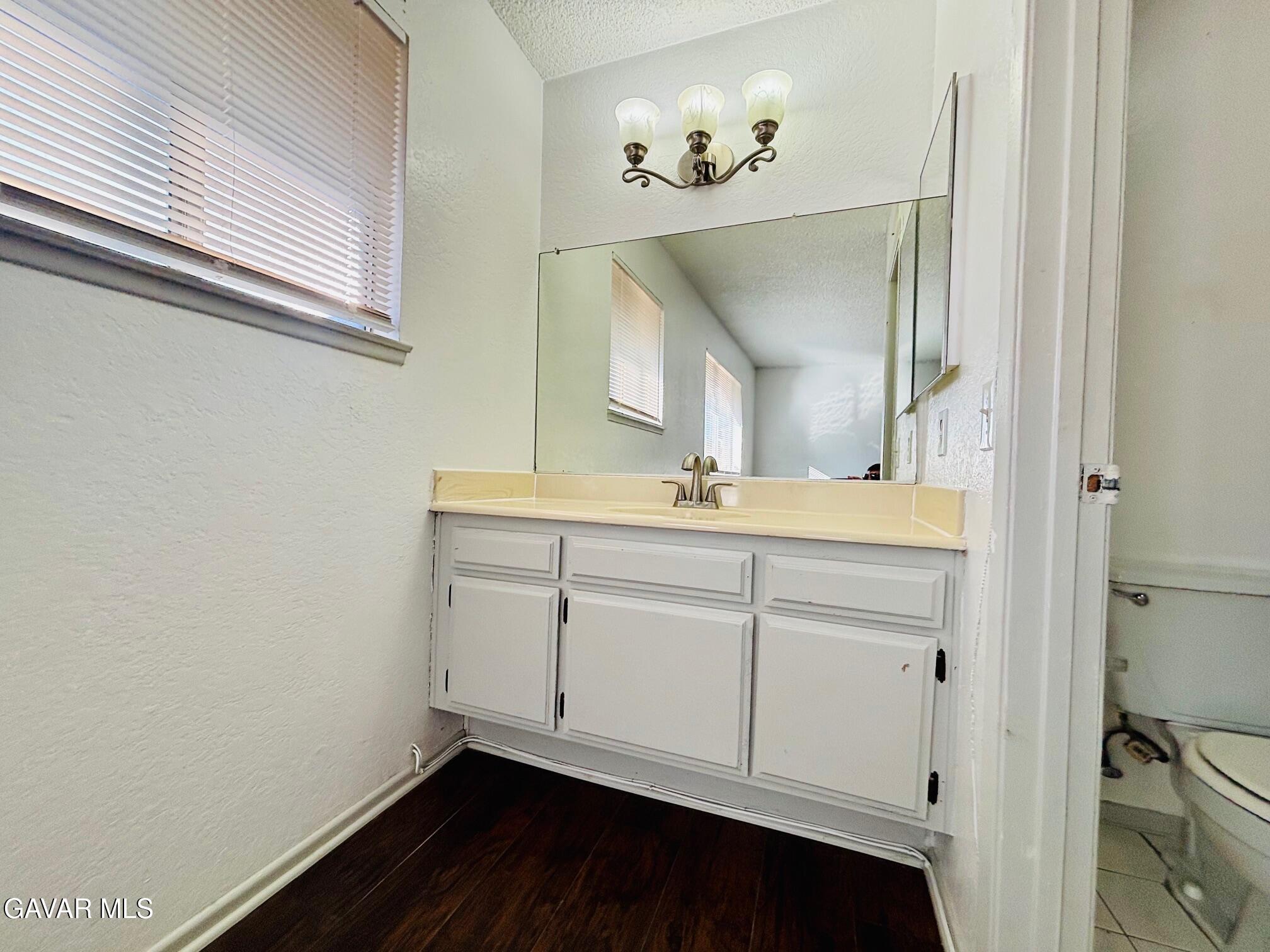 2308 Edam Street Lancaster, CA 93536 - Photo 8 of 16 a bathroom with a sink and a mirror