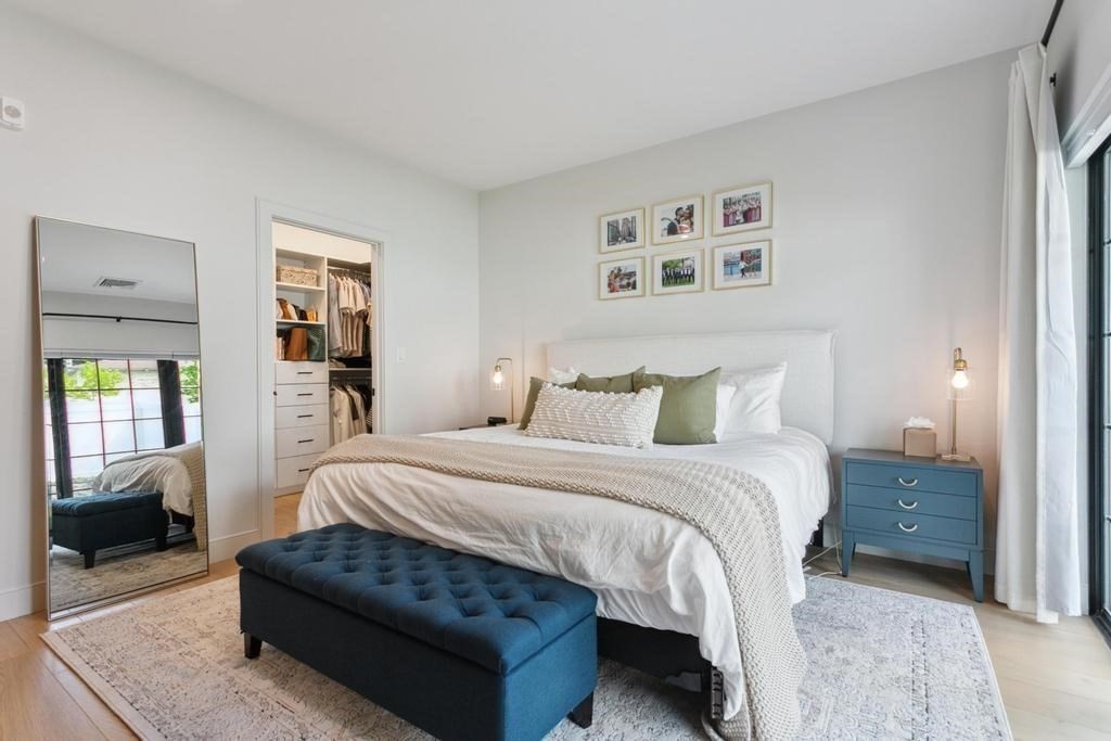 4 Payne Street, Unit 2 Boston, MA 02122 - Photo 13 of 28 a spacious bedroom with a bed and a couch