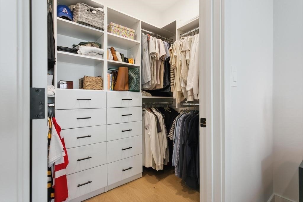 4 Payne Street, Unit 2 Boston, MA 02122 - Photo 14 of 28 a view of walk in closet with clothes and shoes