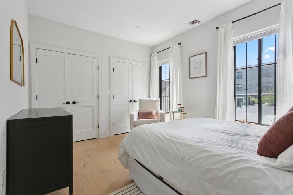4 Payne Street, Unit 2 Boston, MA 02122 - Photo 18 of 28 a bedroom with a bed and a window