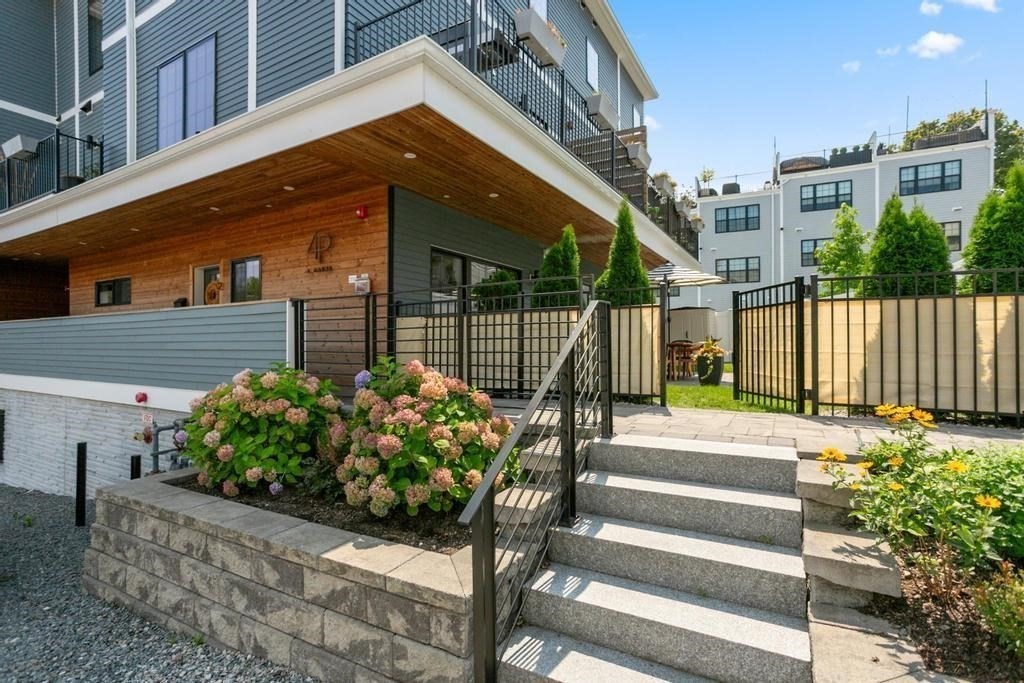 4 Payne Street, Unit 2 Boston, MA 02122 - Photo 23 of 28 a front view of a house with a garden