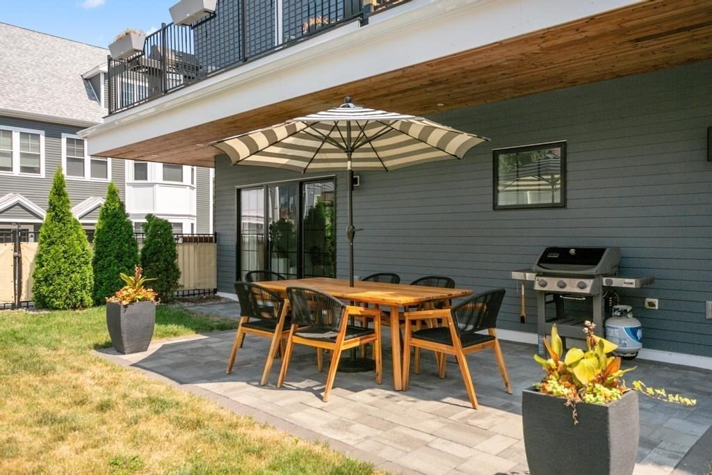 4 Payne Street, Unit 2 Boston, MA 02122 - Photo 3 of 28 a patio with a table and chairs
