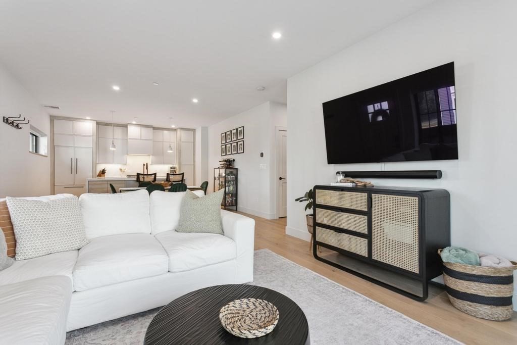 4 Payne Street, Unit 2 Boston, MA 02122 - Photo 9 of 28 a living room with furniture and a flat screen tv