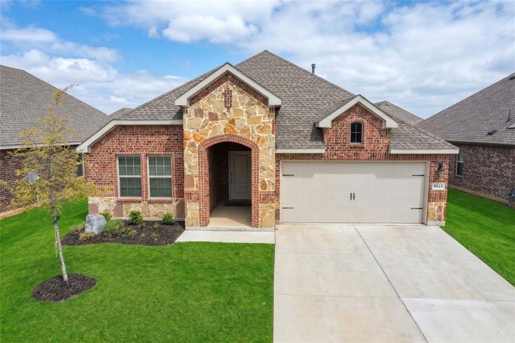 9813 Daisy Mae Aubrey, TX 76227 - Photo 1 of 28 a front view of a house with a yard