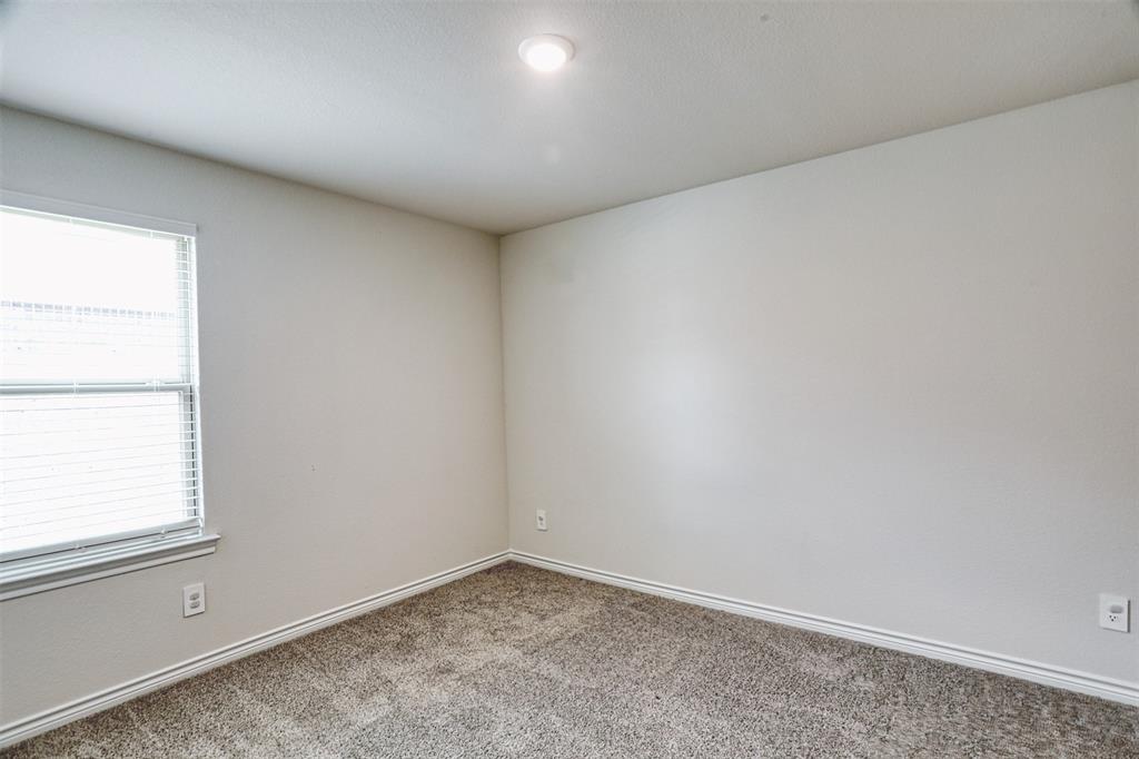 9813 Daisy Mae Aubrey, TX 76227 - Photo 17 of 28 an empty room with a window