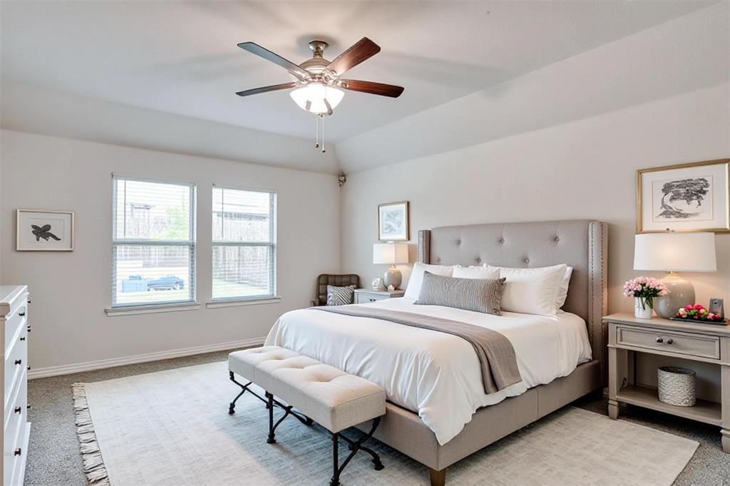 9813 Daisy Mae Aubrey, TX 76227 - Photo 18 of 28 a bedroom with a large bed and a window